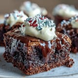 Festive firecracker brownie bites with creamy frosting and patriotic sprinkles, perfect for Fourth of July celebrations.