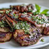 Juicy lamb chops seasoned with garlic and rosemary, served with a zesty mint gremolata bursting with lemon and parsley.