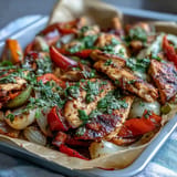 Juicy Sheet Pan Chicken Fajitas, ready to be served with warm tortillas.