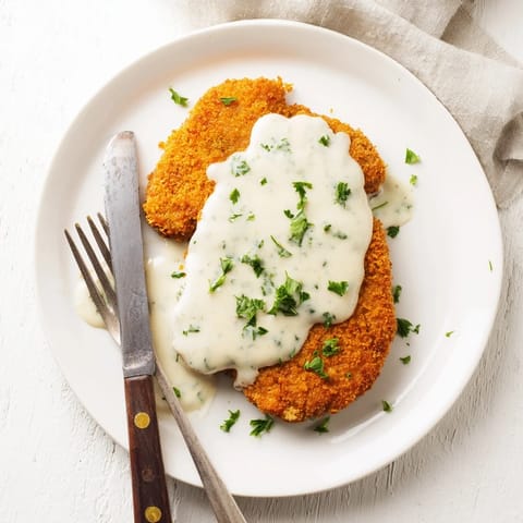 Tenderized beef cube steak coated in seasoned breading, fried to perfection and drizzled with rich peppery white gravy.  
