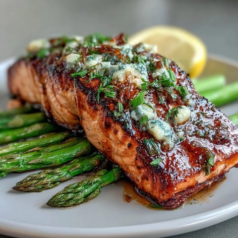 Garlic Butter Salmon with Asparagus, golden pan-seared fillets in a fragrant garlic butter sauce with crisp-tender asparagus.